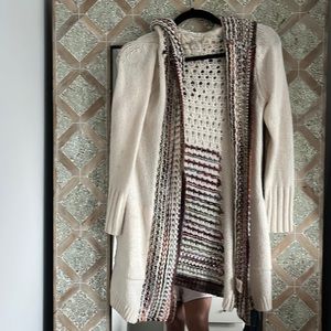 XSP Cozy chunky knit long sweater with a hood .